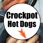 A crockpot filled with several hot dogs, some partially covered by a lid. Below the image, a circular text overlay reads "Slow Cooker Hot Dogs" with an arrow pointing to the hot dogs inside the crockpot.