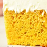 Close-up image of a slice of pumpkin cake with thick white frosting. The cake has a light, airy texture. Text overlay reads: "Pumpkin Cake with Yellow Cake Mix Hack!".