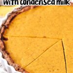 A close-up of a sweet potato pie with a golden filling in a white pie dish. The pie has been cut into portions. The text above the pie reads "Recipe for Sweet Potato Pie with Sweetened Condensed Milk." A yellow cloth is partially visible in the background.