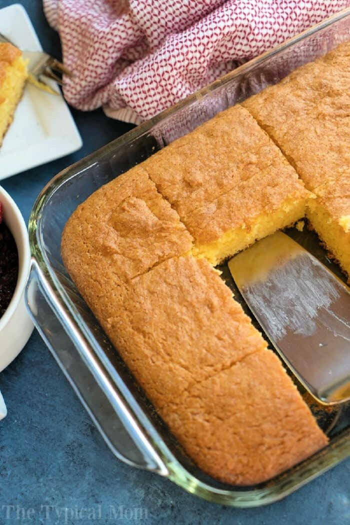 A glass baking dish evoking the coziness of egg nog pudding cake fresh from the oven.