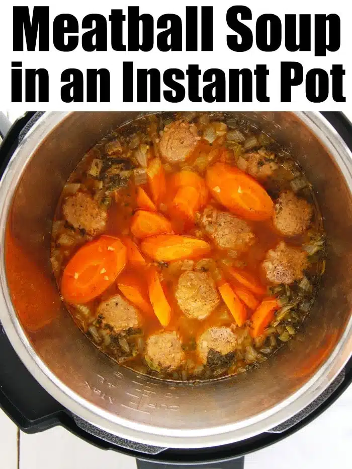 Easy Instant Pot meatball soup made with homemade or frozen meatballs in under 20 minutes flat! A healthy low carb and keto friendly dinner you'll love. #instantpot #instantpotsoup #meatballsoup #keto #lowcarb #thetypicalmom #instantpotrecipes Instant Pot meatball soup with carrots and herbs simmering to perfection, viewed from above.
