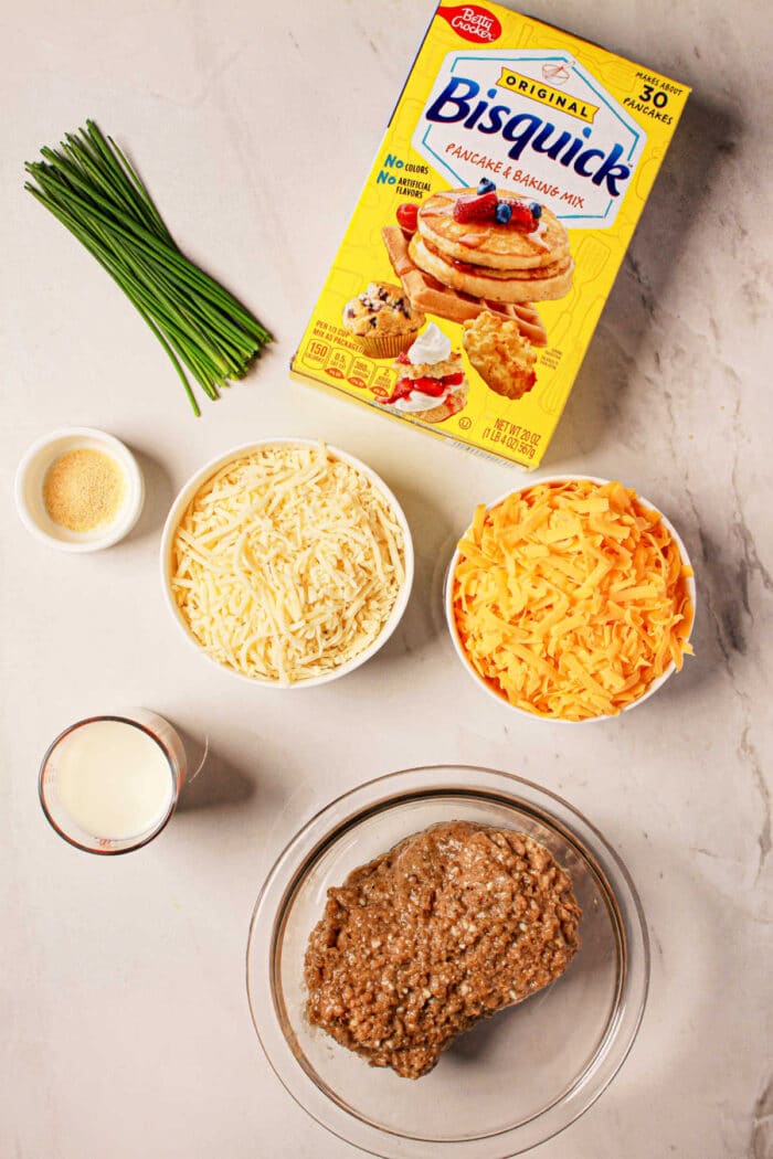 Combine the Bisquick, chives, garlic powder, shredded cheese, milk, and sausage in a bowl to create delectable sausage balls perfect for any occasion. For a quick and easy option, try using a pressure cooker to speed up your cooking time without sacrificing flavor.