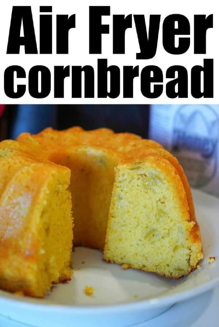 A sliced, golden-brown air fryer cornbread ring sits on a white plate under the words Air Fryer Cornbread.