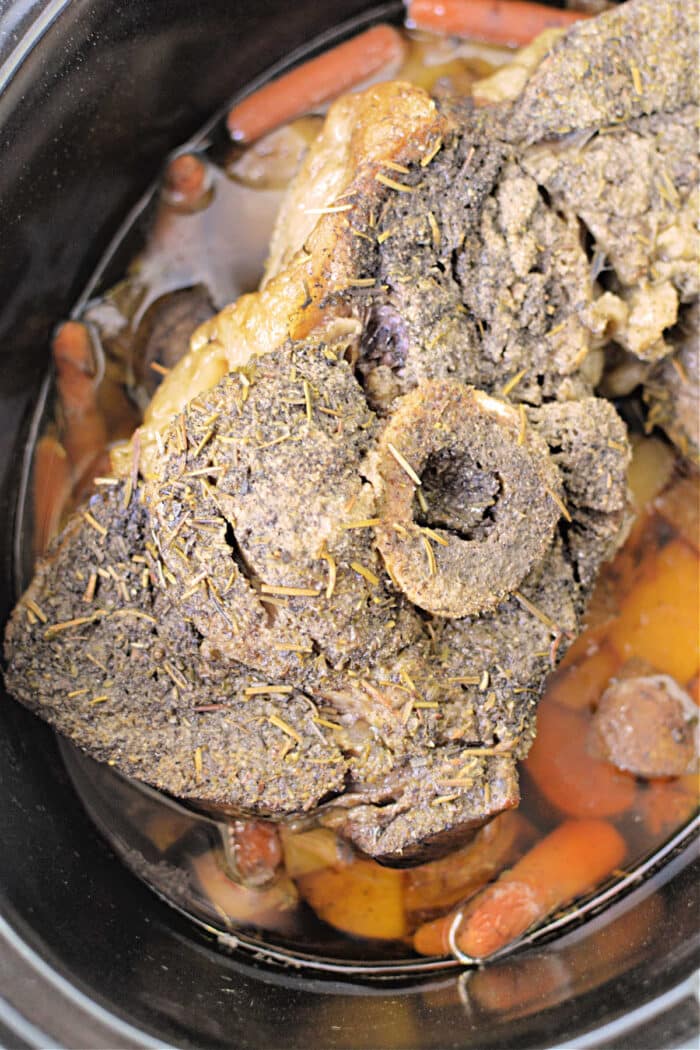 Savor this seasoned Arm Roast with vegetables and broth, simmered to perfection in a slow cooker.