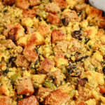 Golden Jiffy cornbread stuffing with cubed bread, celery, herbs, and mushrooms bakes to perfection in a cozy dish.