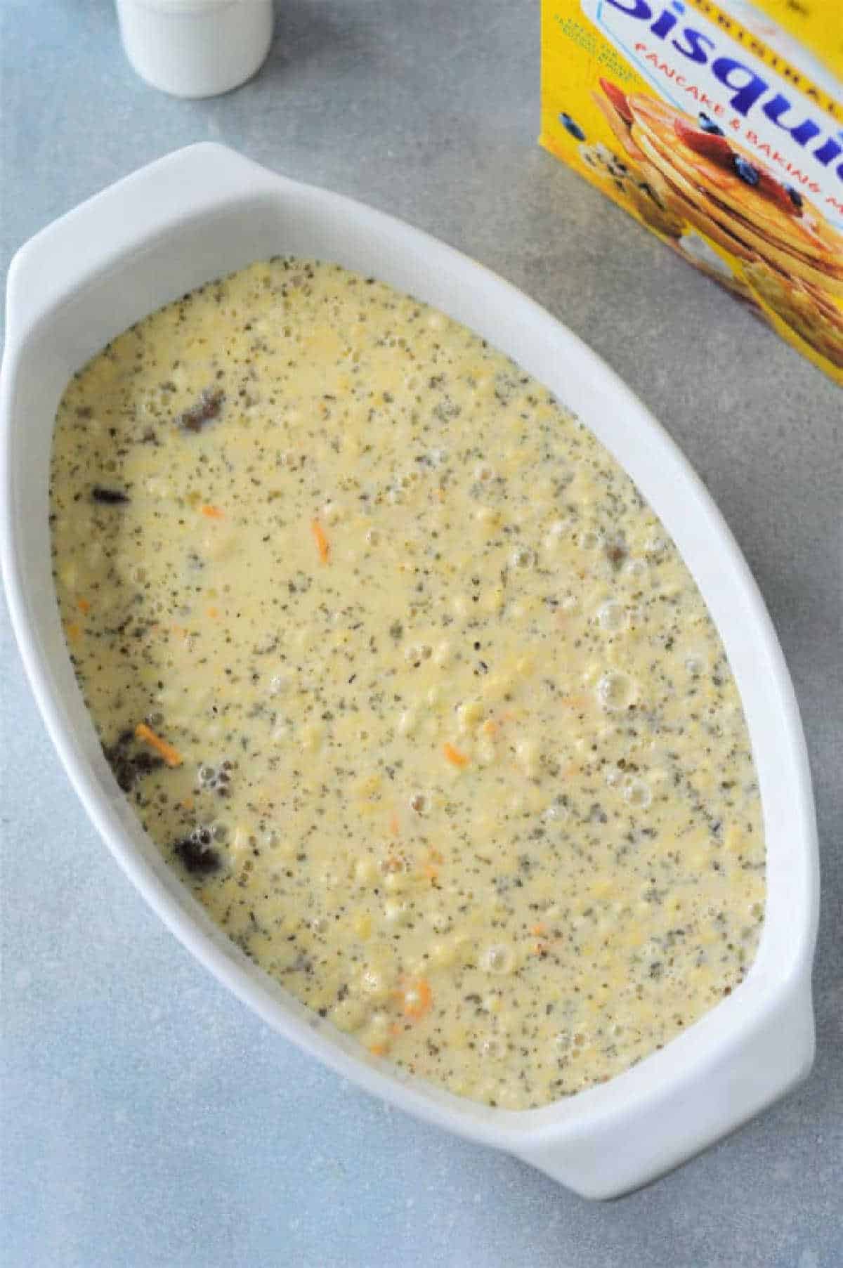 A white bowl with a delicious Breakfast Casserole with Bisquick in it.