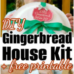 Smiling girl holds a DIY gingerbread house kit; kids below gather around a table, excitedly decorating their own gingerbread houses.