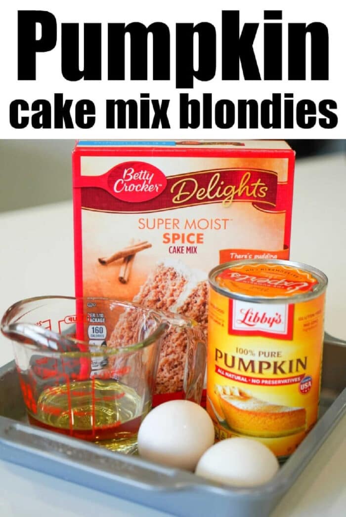 A box of spice cake mix, a can of pumpkin, two eggs, and oil come together in a pan for easy pumpkin blondies.