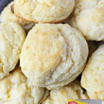 A bowl of golden sour cream biscuits made with Bisquick mix, with text: Sour Cream biscuits with Bisquick.