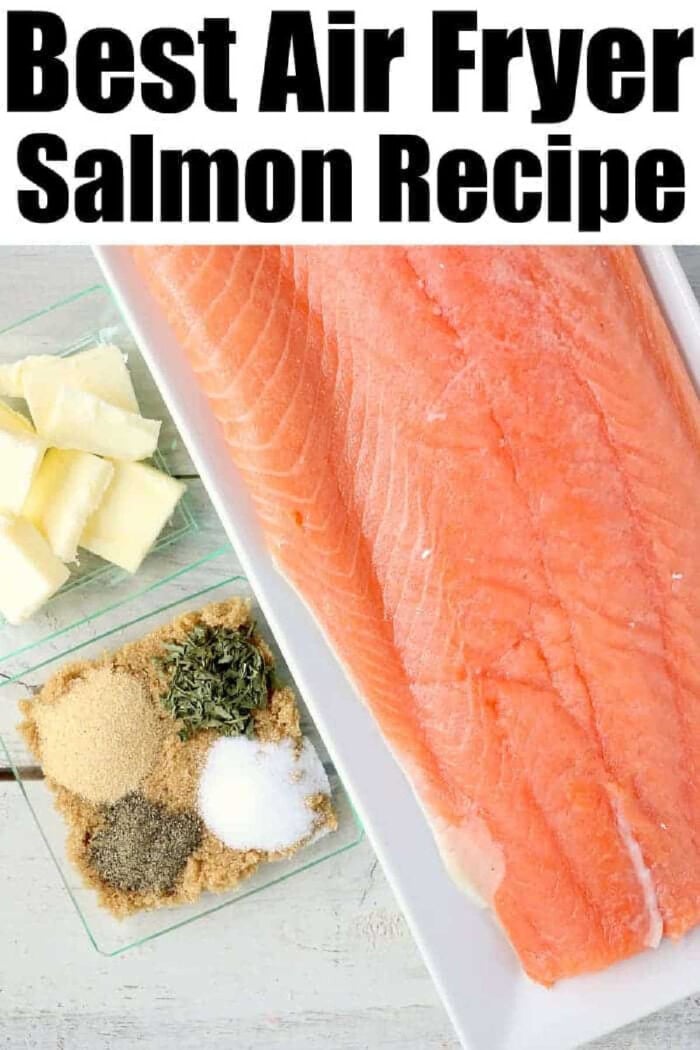 Best air fryer salmon. This comes out amazing! With a sweet glaze on top cooking fish in a Ninja Foodi or other brand is easy and a healthy dinner you'll love. #ninjafoodirecipes #salmon #airfryerrecipes #airfryersalmon #fish #foodi #ninjafoodi #thetypicalmom Raw salmon fillet with small dishes of butter and various seasonings on a light surface, perfect for preparing salmon in the air fryer.