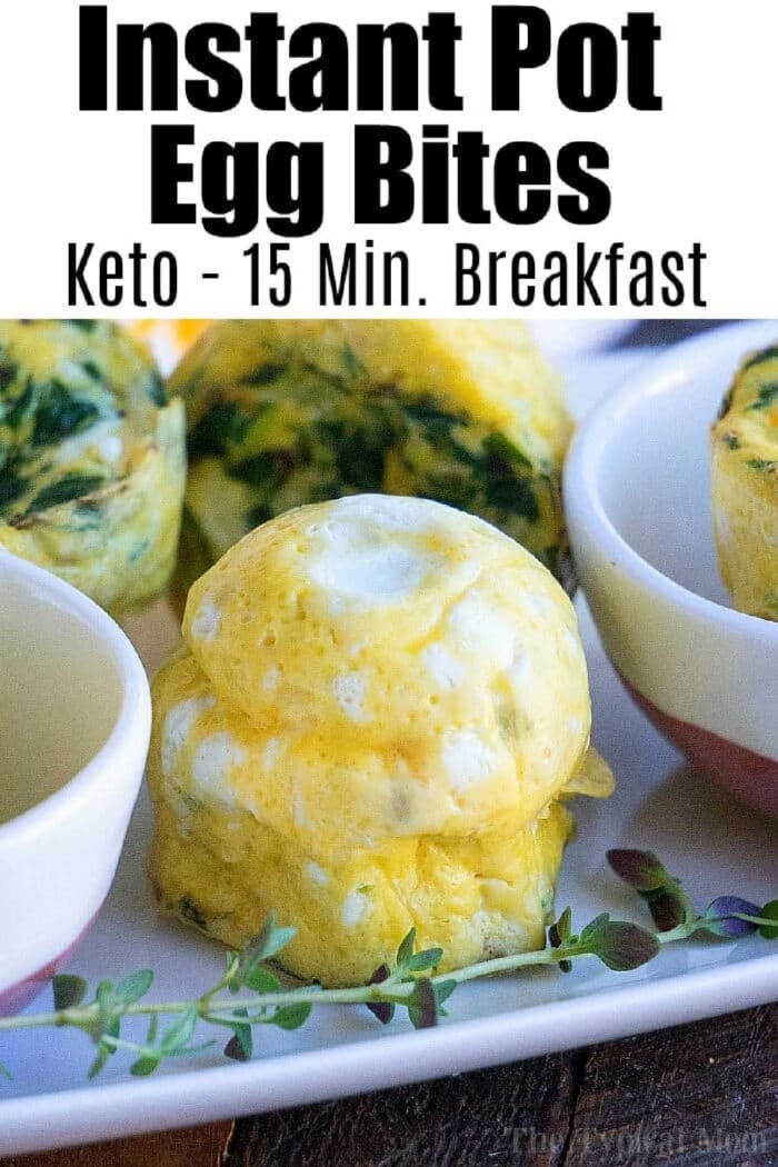 Pressure cooker egg bites are the perfect protein packed breakfast for busy mornings. A great Keto Instant Pot recipe with just a few ingredients. #instantpot #eggbites #starbucks #keto #instantpotrecipes #pressurecooker #crockpotexpress #thetypicalmom A close-up of pressure cooker egg bites on a plate, with text about a keto 15-minute breakfast.