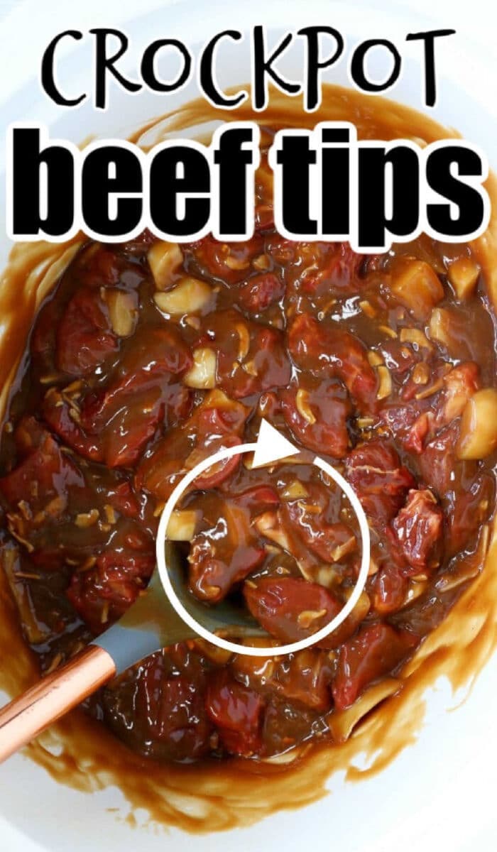 Beef tips in brown sauce in a crockpot, being stirred with a spoon. Text reads Slow Cooker Beef Tips.