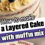 A layered Muffin Mix Cake with blueberries on top sits beside boxes of Krusteaz Wild Blueberry Muffin Mix.
