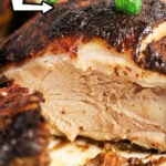 Close-up of juicy oven jerk chicken topped with green onions, with text Jerk Chicken in the Oven above.