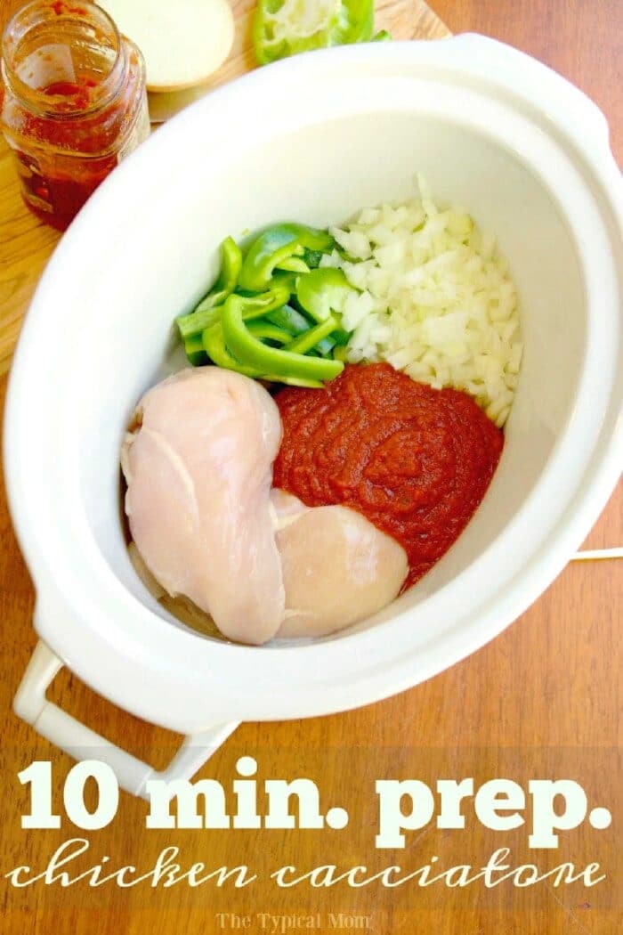 Crockpot chicken cacciatore recipe we love! If you've never made this it literally takes 10 min. to prep and my kids love it too over rice! A really healthy slow cooker dinner we make often because it is cheap and only needs a few ingredients which I love when I'm in a hurry to put a meal together. #crockpotrecipes #chicken #cacciatore #slowcooker #healthy #thetypicalmom #chickencacciatore Uncooked chicken, tomato sauce, chopped onions, and green peppers in a slow cooker—everything you need to prep classic crockpot chicken cacciatore.