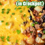 Close-up of cheesy Cowboy Casserole with ground beef, potatoes, beans, corn, and green onions cooked to perfection in a crockpot.