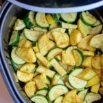 Air Fryer Squash and Zucchini features sliced zucchini and yellow squash, perfectly seasoned and cooked in an air fryer basket for a quick, healthy side dish.