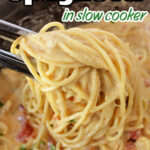 Spaghetti and creamy chicken sauce being lifted by tongs from a pot, with text Chicken Spaghetti in Crockpot.