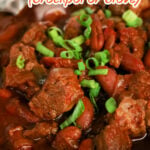 Bowl of chili with beef chunks, beans, and green onions, with text Chuck Roast Chili Recipe (crockpot or stove) — this hearty beef chili is perfect for cozy nights and packed with flavor in every bite.