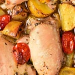 Baked chicken thighs with roasted potatoes and tomatoes; find out how long to bake chicken thighs at 375.