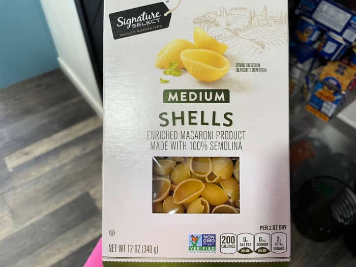 A box of Signature Select medium shells pasta, perfect for a crockpot lasagna casserole.